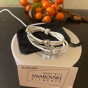 SWAROVSKI in  white and glitter bracelet w/ pouch .clasp closure . NWT w/ card .